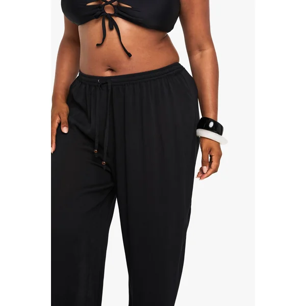 Pantalon De Plage Grande Taille À Jambes Larges Avec Perles Et Tissu Froissé